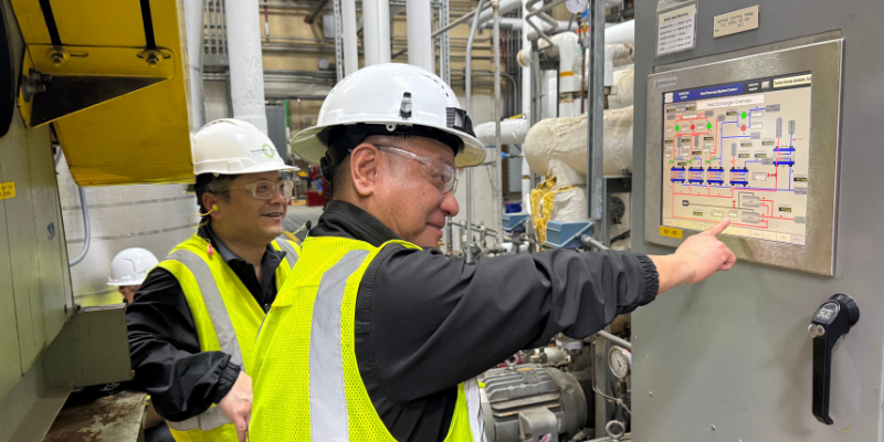 TEI Engineers using a control panel