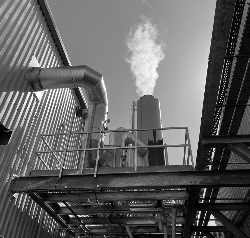 Hybrid FLU-ACE with steam coming out installed at a Meat Processing Plant